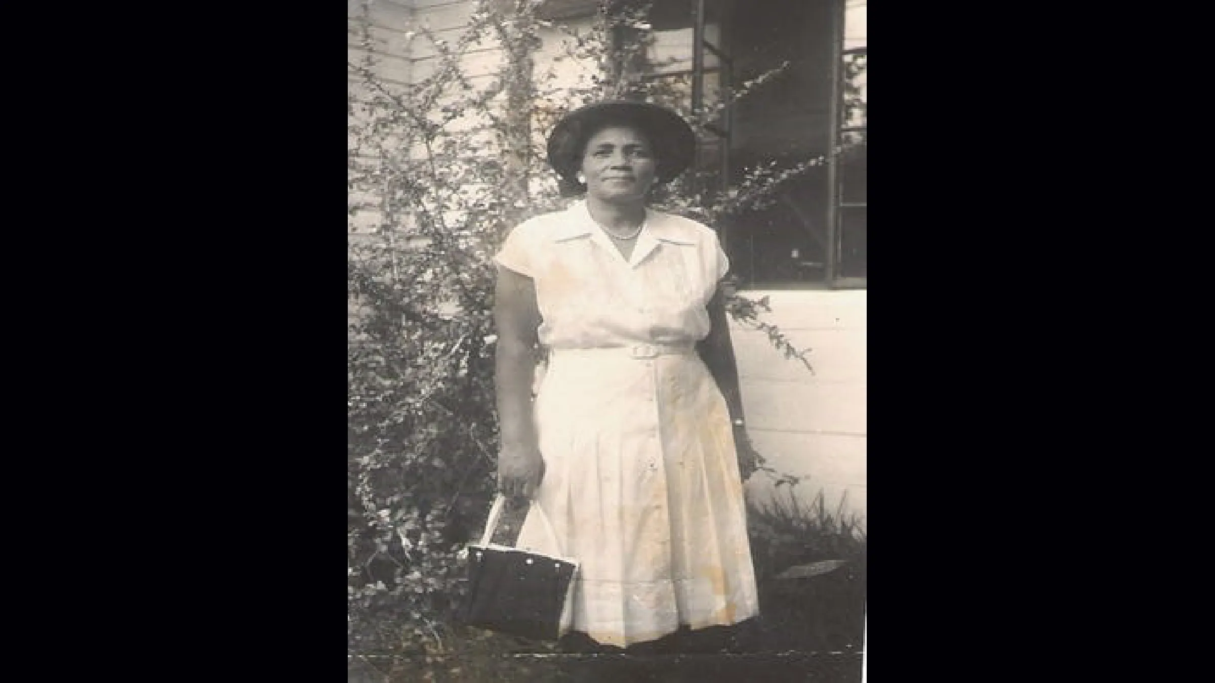 Rosa L. Jones standing, early photograph